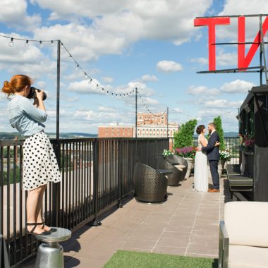 photographer shoots wedding picture on redmont hotel rooftop