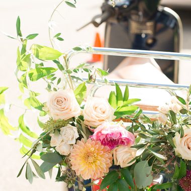 vespa with flowers on the back for a wedding