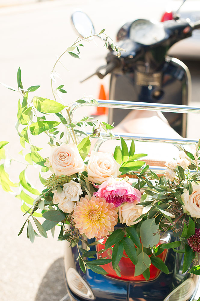 vespa with flowers on the back for a wedding