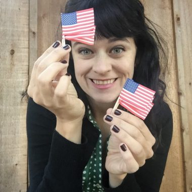 carrie rollwagen holding tiny american flags