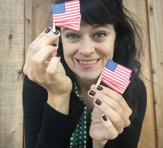 carrie rollwagen holding tiny american flags