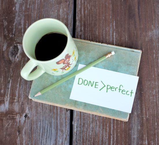 coffee cup and done is better than perfect message on a notecard