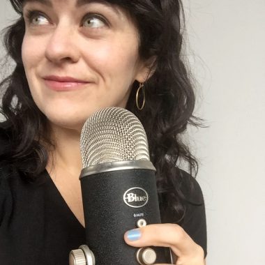 carrie rollwagen holds podcast mic