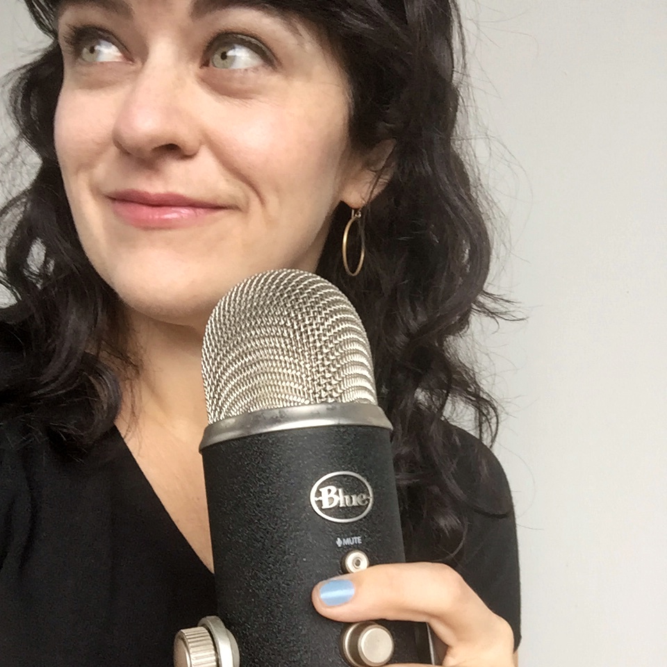 carrie rollwagen holds podcast mic