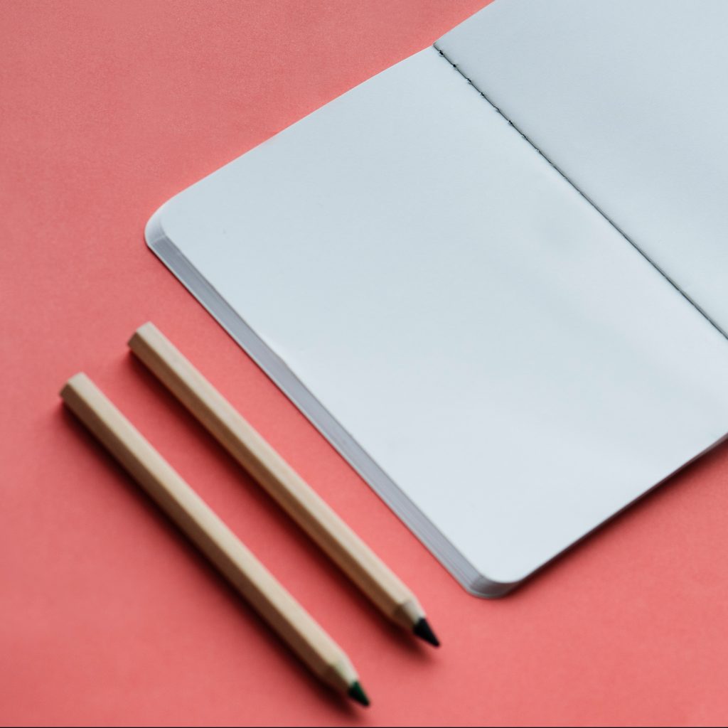 notebook and pencils